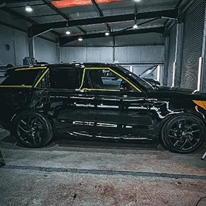 side black car and yellow strip